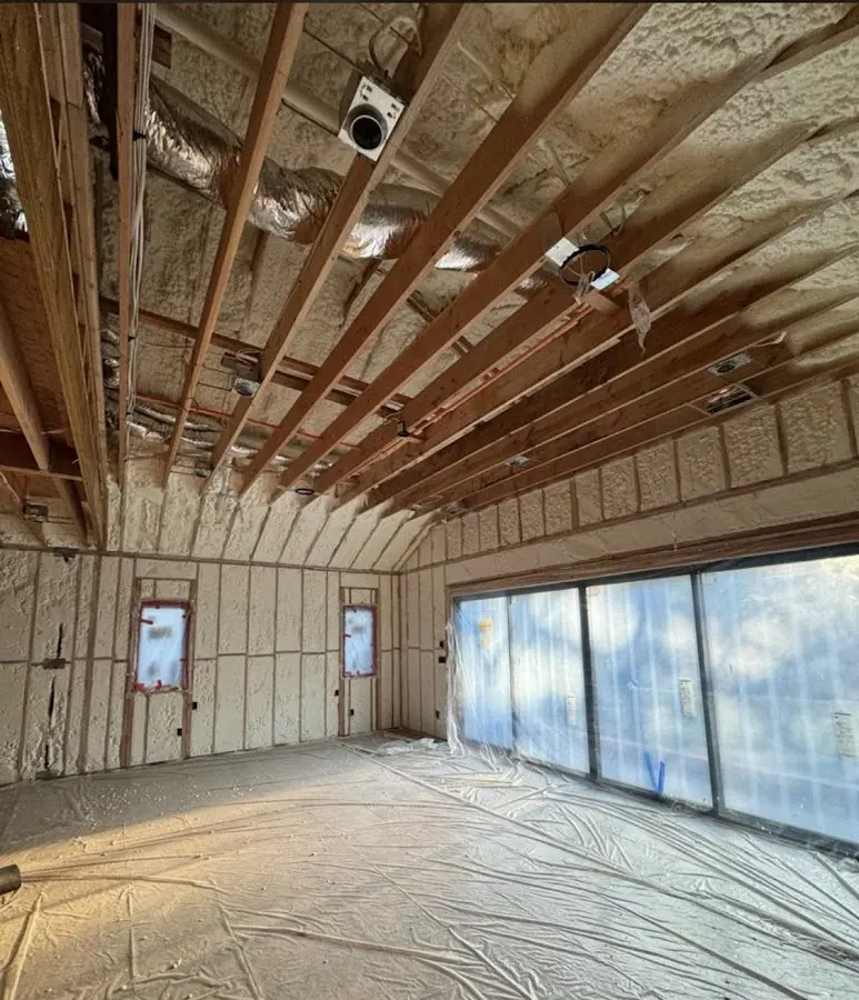 Interior walls and ceiling insulated with spray foam during new construction in Colonie